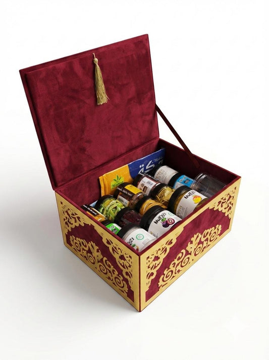 Decorative box with a tassel lid containing various bottles on a white background